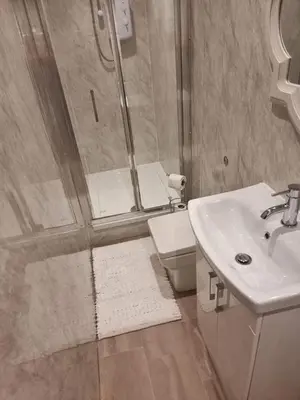 a bathroom with a shower and a sink and a toilet at Carlisle City Centre, Cute Victorian House. in Carlisle