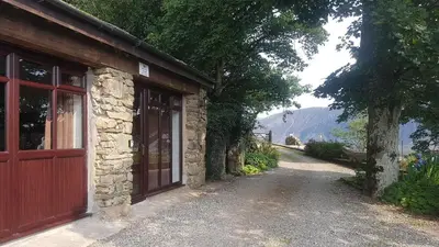 a building with a door on the side of a road at Scafell Cottage on The Big 