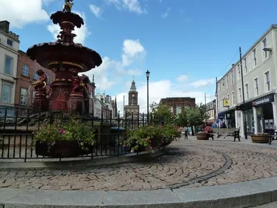 a fire hydrant in the middle of a city at Belmont Cottage in Dumfries