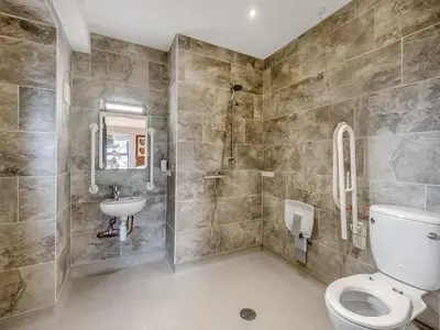 a bathroom with a toilet and a sink at The Barn Owl - Uk36217 in Bowness-on-Solway