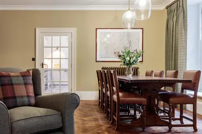 a dining room with a table and chairs at The Vicarage in Keswick