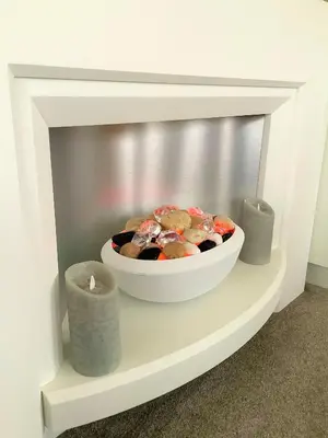a bowl of food on a shelf in a fireplace at Cumbria Reach in Longtown