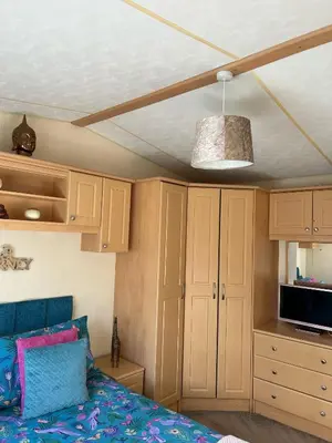 a bedroom with a bed and a ceiling at 24 The Beeches Caravan Park in Gilcrux