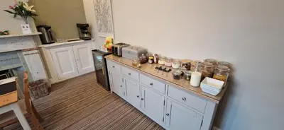 a kitchen with a counter with jars on it at Glencoe Guest House in Keswick