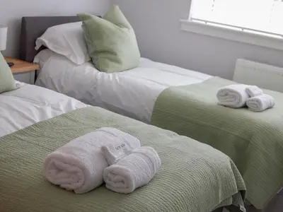 two towels on two beds in a room at 2 Mote View- Uk37496 in Sandhead
