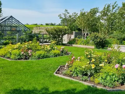 a garden with many different types of flowers at Beacon Cottage in Ivegill