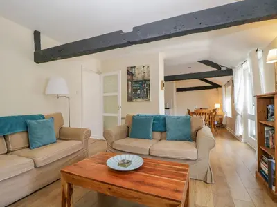 a living room with two couches and a coffee table at The Old Mill in Keswick