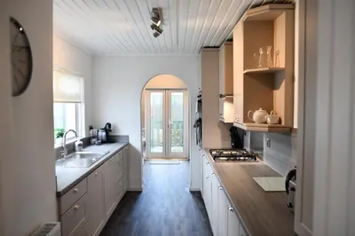 a kitchen with a sink and a counter top at The Prestwick Pad in Prestwick