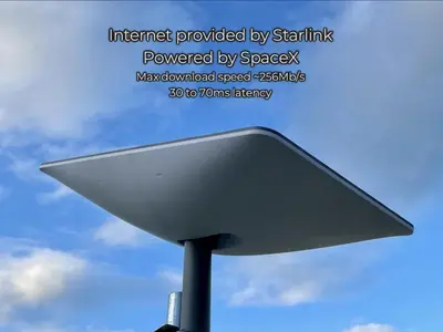 a white satellite dish on a pole in the sky at Discover, Enjoy Ultra-Fast Starlink WiFi Lodge in Carlisle