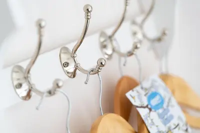 a row of glasses hanging on a wall at Rhubarb Cottage in Chapel Stile