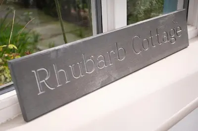 a sign that reads rutherford college on a window sill at Rhubarb Cottage in Chapel Stile