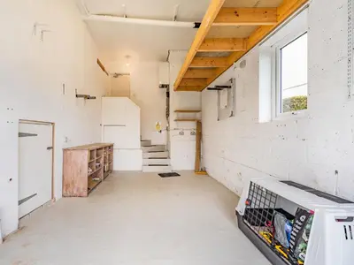 an empty room with stairs and a window at Fairview in Keswick