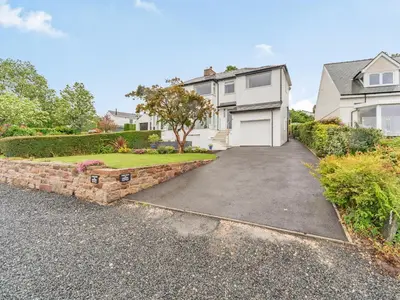 a driveway in front of a white house at Fairview in Keswick