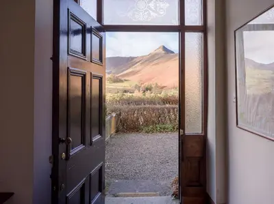 an open door with a view of a mountain at Yewthwaite Newlands Keswick in Keswick