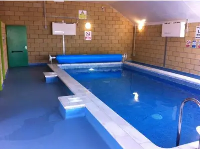 a large swimming pool in a building at AJL Caravan Rentals in Turnberry