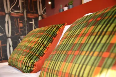 two pillows sitting on top of a bed at Masonic Arms Gatehouse in Gatehouse of Fleet