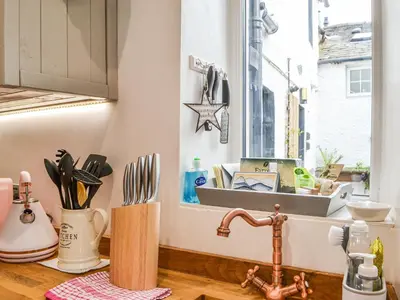 a kitchen counter with a sink and a window at Pollywiggle Cottage in Keswick
