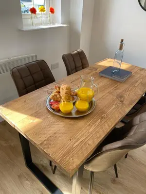 a plate of breakfast food on a wooden table at Beachcomber in Garlieston