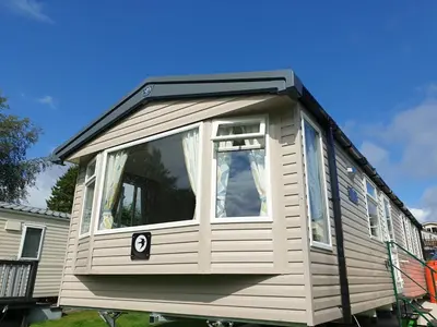 a tiny house with the number on it at Coral Cabin in Kippford