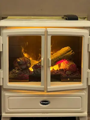 a stove with two glass doors with food inside at Sea-Renity - Self Catering Holiday Let in Douglas
