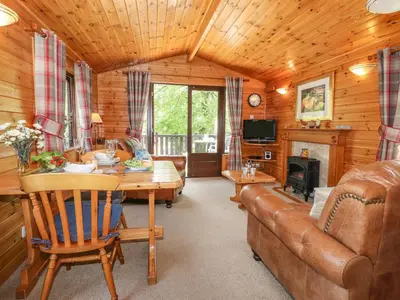 a living room with a couch and a table at Robin's Nest in Keswick