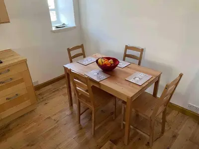 a wooden table with a bowl of fruit on it at House - Sleeps 4 Pet Friendly & Free Parking in Symington