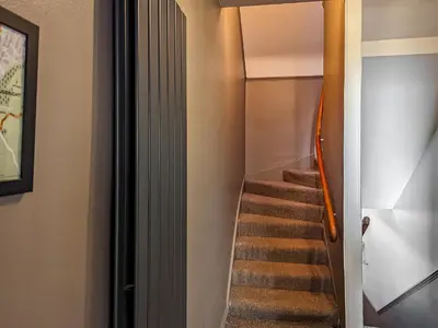 a staircase in a house with a stair case at 9A Church Place in Kirkcudbright