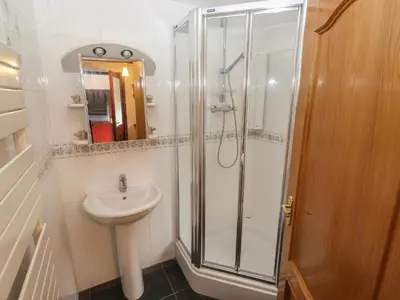 a bathroom with a shower and a sink at Beech Nook in Keswick