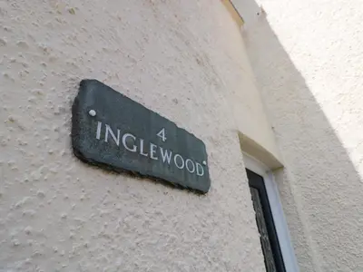 a sign on the side of a building at Inglewood in Keswick