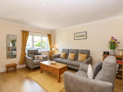 a living room with two couches and a coffee table at Inglewood in Keswick