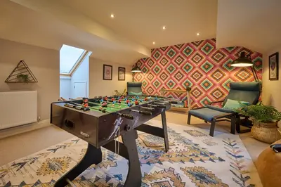 a living room with a chess board on a table at Riverside Park 5 in Keswick