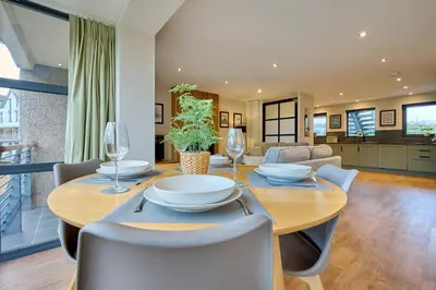 a dining room with a table and chairs at Riverside Park 3 in Keswick