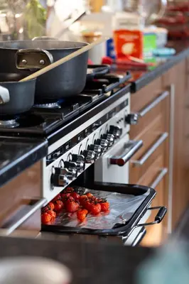 an oven with pots and pans on top of it at Bojangles Guest House in Gretna Green