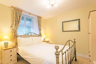 a bedroom with a bed and a window at Keswick View in Keswick