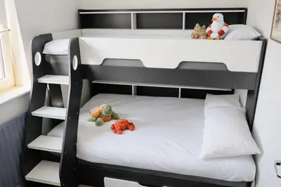 two bunk beds with stuffed animals sitting on them at Beautiful Beach Front Cottage in Allonby