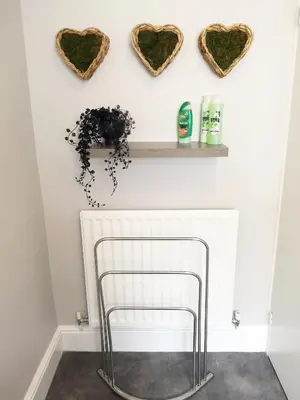 a room with hearts on the wall and a chair at Logan House, Modern and Spacious Townhouse close to City Centre in Carlisle