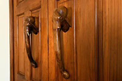 two wooden doors with handles on a wooden wall at Craigadam Lodge with Hot tub in Castle Douglas