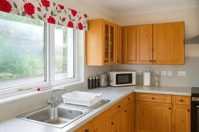 a kitchen with a sink and a window at 3 Bed Bungalow - Sleeps 6 - Pet Friendly - Parking in Drummore