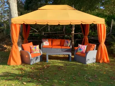 an orange gazebo with chairs and a table at Havenwood in Ayr