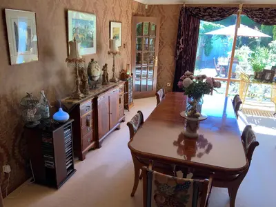 a dining room with a wooden table and chairs at Havenwood in Ayr