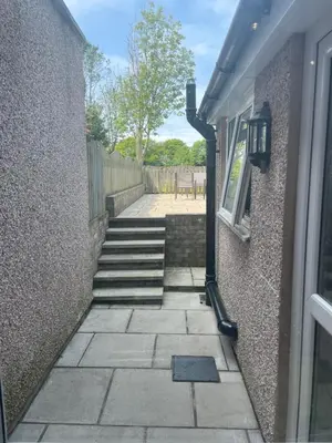 a stairway leading up to a building with a window at Flosh Cottage Lake District in Cleator