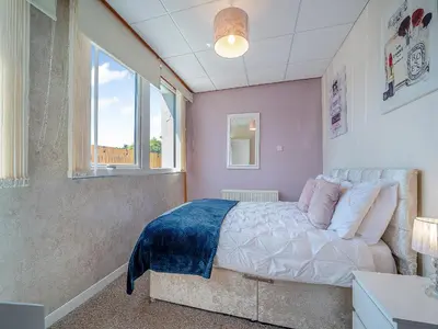 a bedroom with a bed and a window at 1 Ladyknowe - Uk39970 in Moffat
