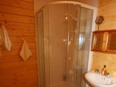a bathroom with a shower and a sink at Auchenhill Lodge in Lochend