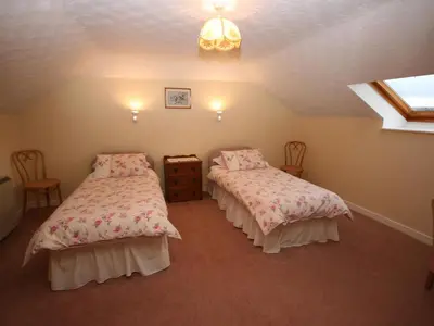a bedroom with two beds in a attic at Halliday Hill Cottage in Dalton