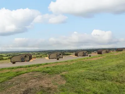 a group of three camels parked on a hill at Laird Lodge 2 in Lockerbie