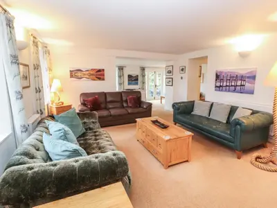 a living room with two couches and a coffee table at Huntingstile Lodge in Ambleside