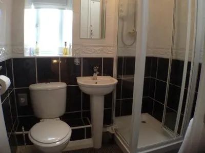 a bathroom with a toilet and a sink at Tarn Hows in Keswick