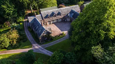 an aerial view of a house with a roof at The Stables in Castle Douglas