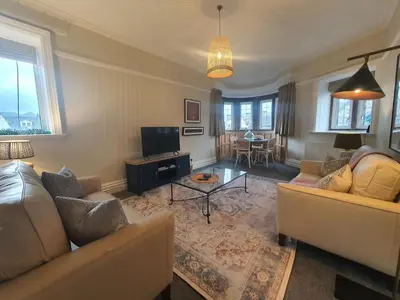 a living room with two couches and a tv at Grandy Nook in Keswick