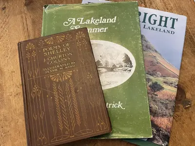 two books sitting next to each other on a table at Shelley Cottage in Keswick